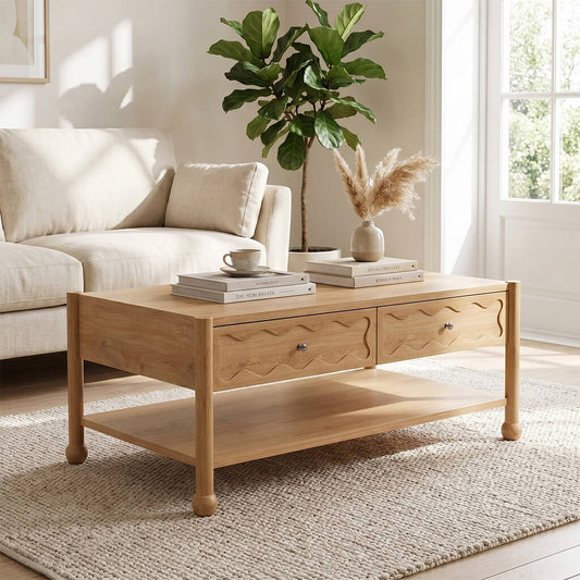 Arlo natural oak coffee table with wave-carved drawer fronts styled in a bright Scandinavian living room