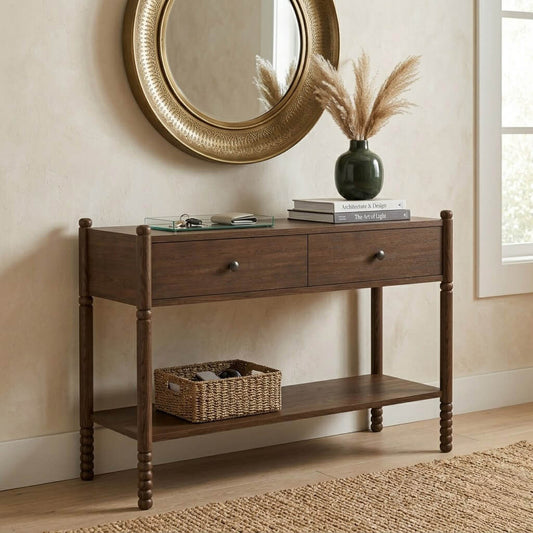 Wing dark walnut console table positioned against an entryway wall with decorative mirror and accessories