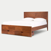 Signature Acacia wood storage bed frame featuring a handcrafted herringbone geometric inlay headboard and two integrated footboard drawers in a warm natural matte finish.