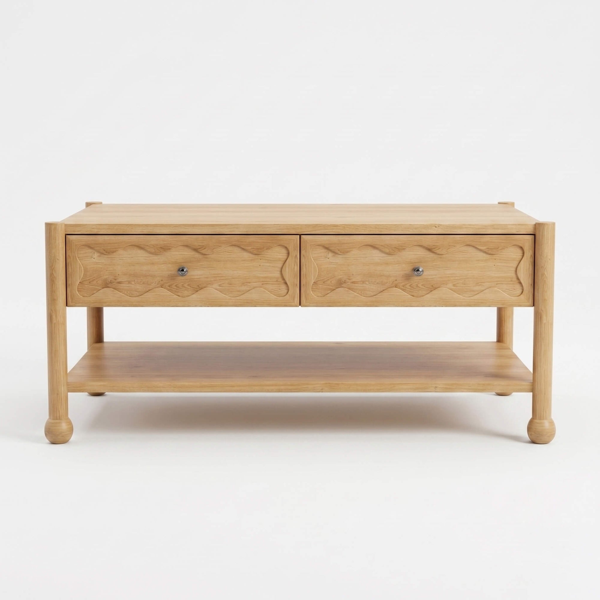Front view of Arlo solid natural oak coffee table with two hand-carved wave motif drawer fronts and bun feet
