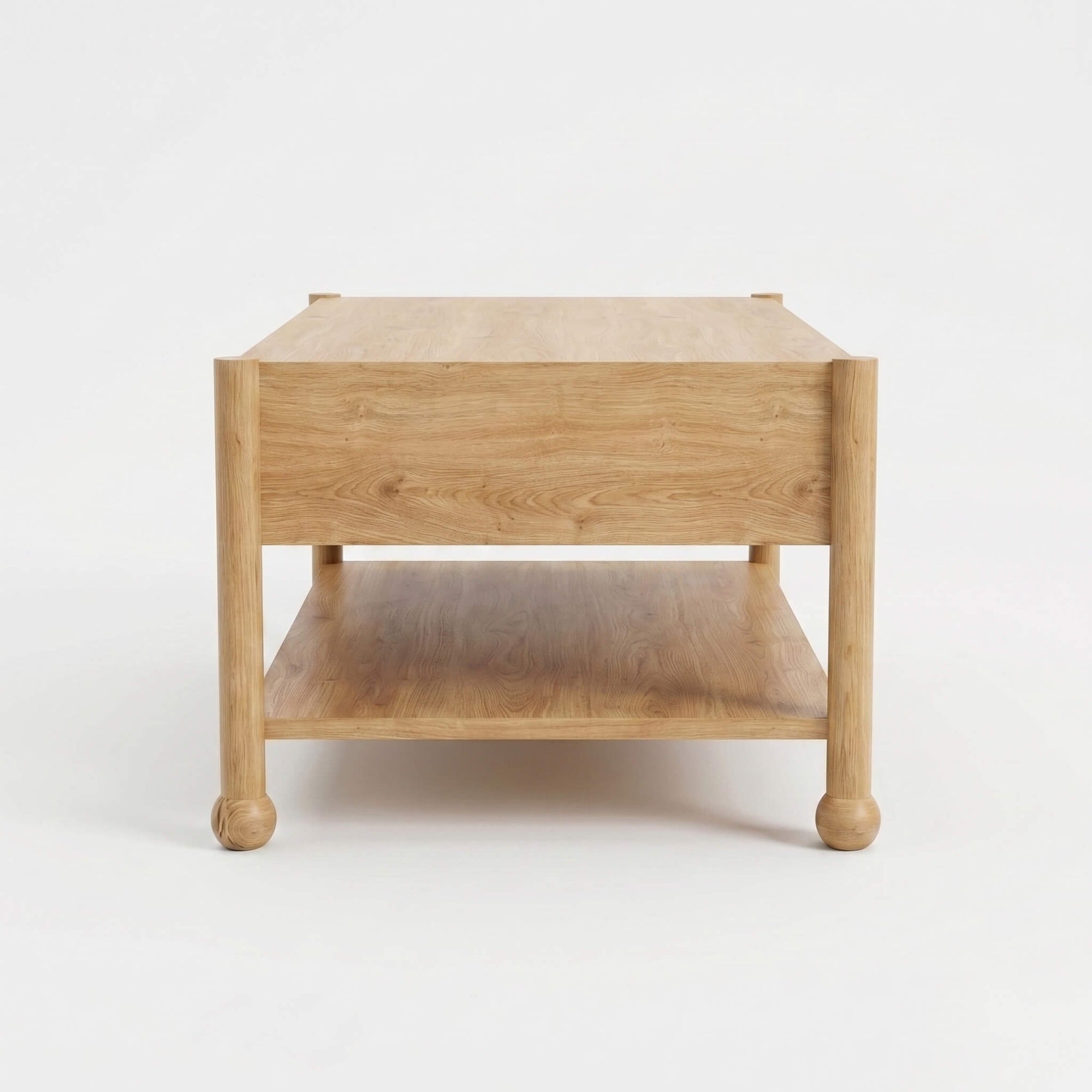 Side profile of Arlo natural oak coffee table showing open lower shelf and classic bun feet