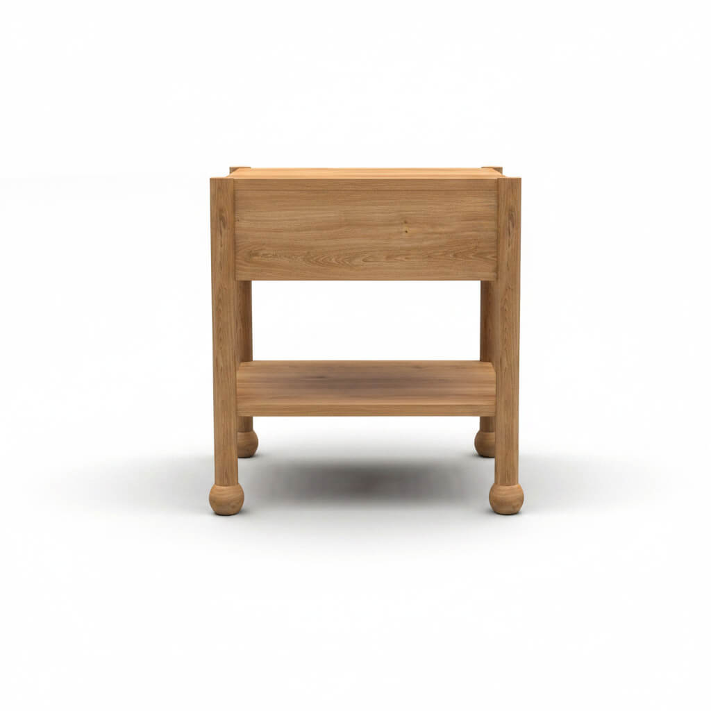 Rear view of Arlo solid wood side table in natural oak showing back panel and bun feet
