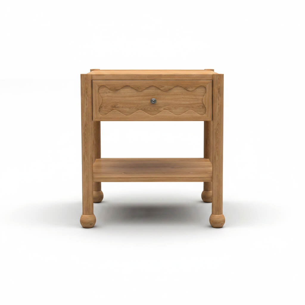 Front view of Arlo solid natural oak side table with hand-carved wave drawer front, open shelf, and bun feet