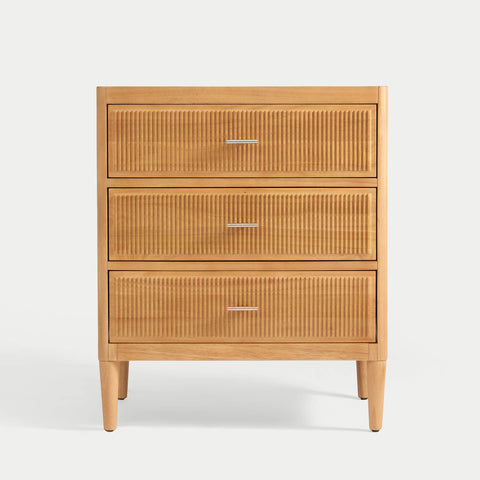 Wooden dresser with three drawers on a white background