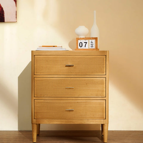 Arlo natural oak wide chest of drawers in a lifestyle setting with plants and home decor