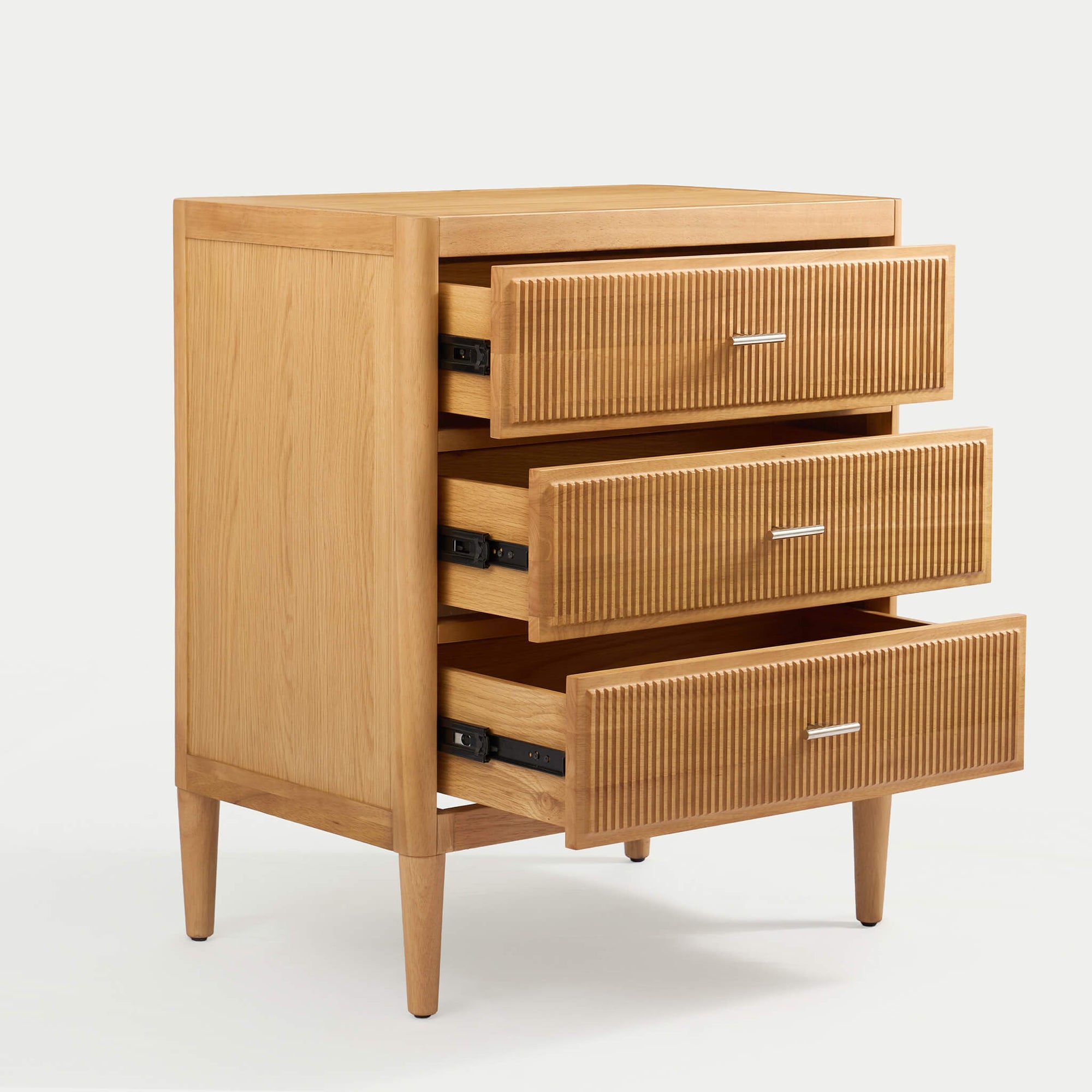 Arlo 3-drawer wide chest in natural oak with drawers partially open showing storage space and smooth-glide runners