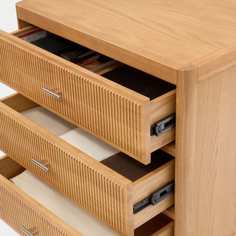 Interior view of Arlo 3-drawer chest in natural oak with all three drawers open showing deep storage compartments
