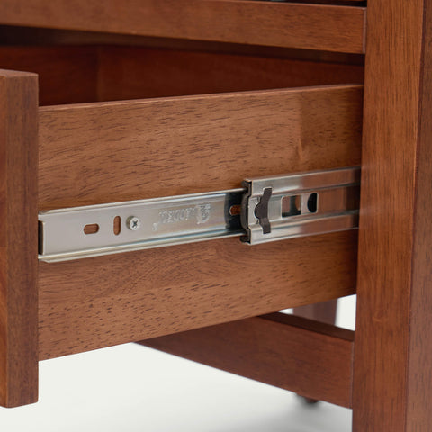 Close-up of a dark walnut solid wood nightstand featuring a high-quality soft-close metal drawer glide mechanism for smooth and quiet operation.