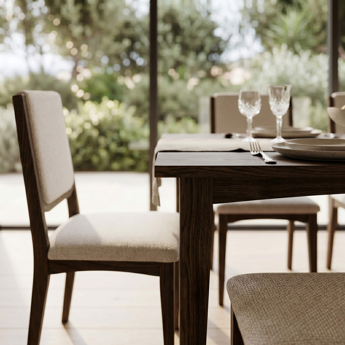 Close-up of Cove dining chair dark walnut frame with cream bouclé upholstered seat and floating back panel