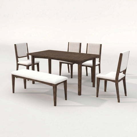 Cove dining chairs and bench around a dark walnut table in a sun-filled modern dining room