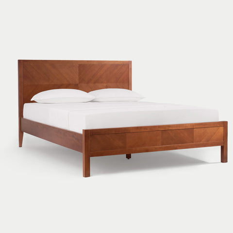 The defining feature of this series is the meticulous, hand-assembled herringbone inlay across the headboard and footboard. Precision-cut and hand-assembled, it creates mesmerizing depth and symmetry, elevating furniture to the level of art.