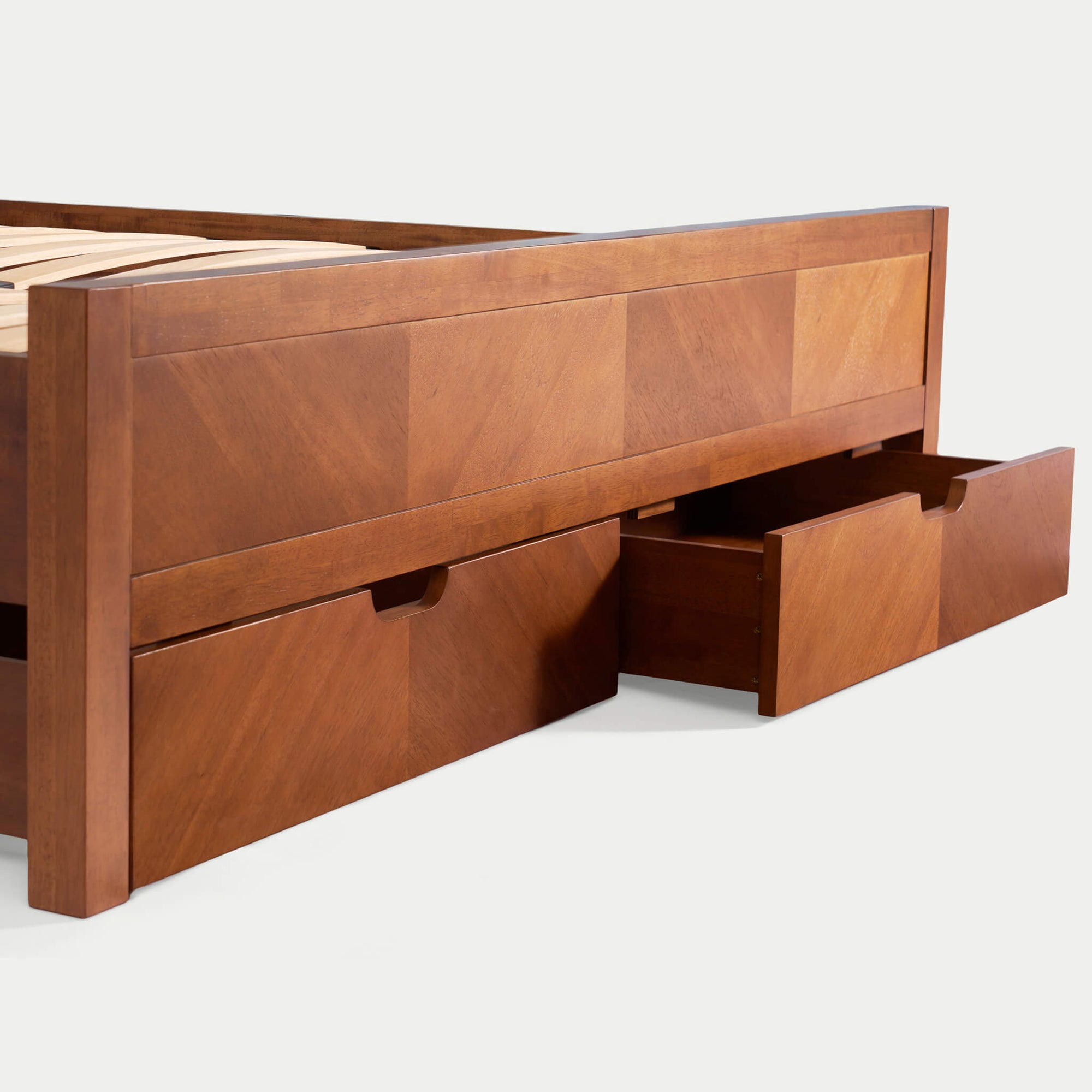 Two spacious drawers are discreetly built into the footboard. Equipped with premium soft-close glides, they provide high-capacity storage without compromising the bed's minimalist silhouette.