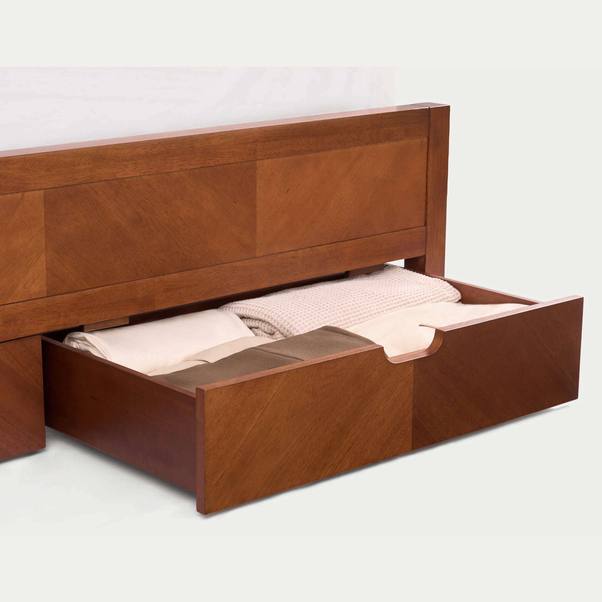 A KREVON Signature Series Acacia Wood Storage Bed, featuring a handcrafted herringbone geometric inlay headboard and footboard, with two integrated footboard drawers and an ergonomic curved solid wood slat support system.