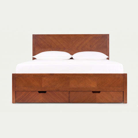 Wings Storage Bed in dark walnut — herringbone headboard with two under-bed storage drawers, styled with white bedding on a warm neutral background